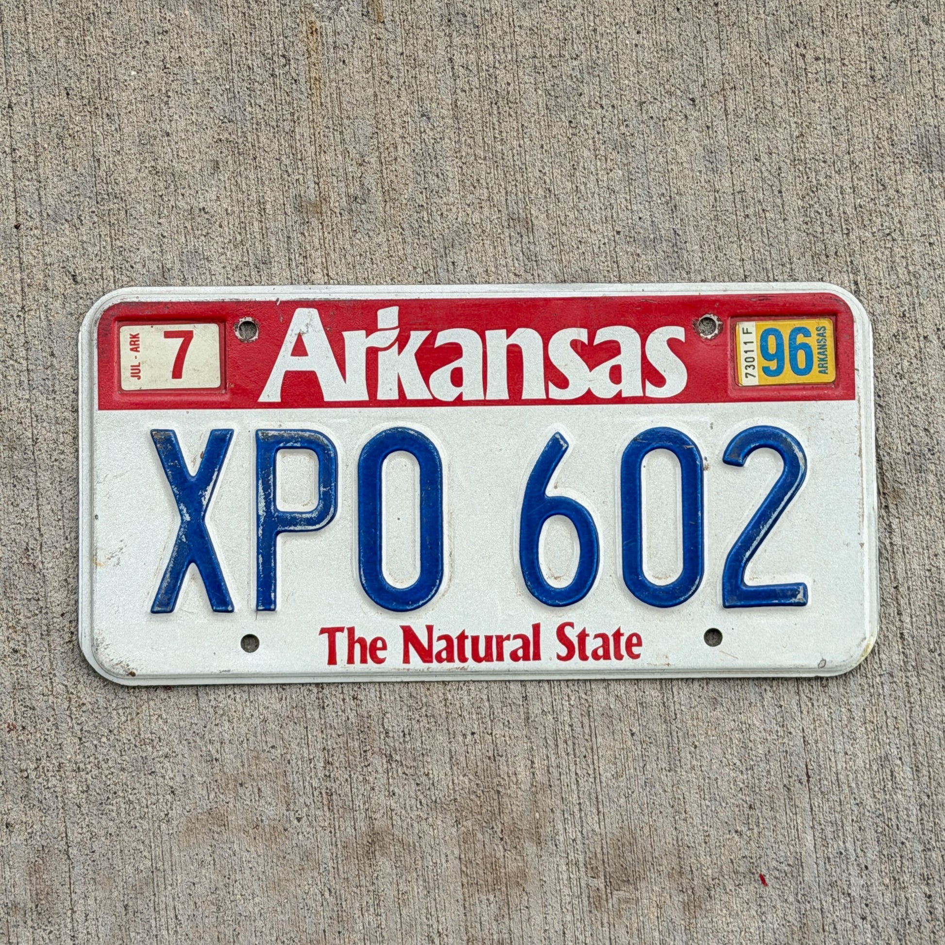 Photo of a 1989 1996 Arkansas License Plate Auto Tag Garage Decor Vintage XPO 602 with original patina