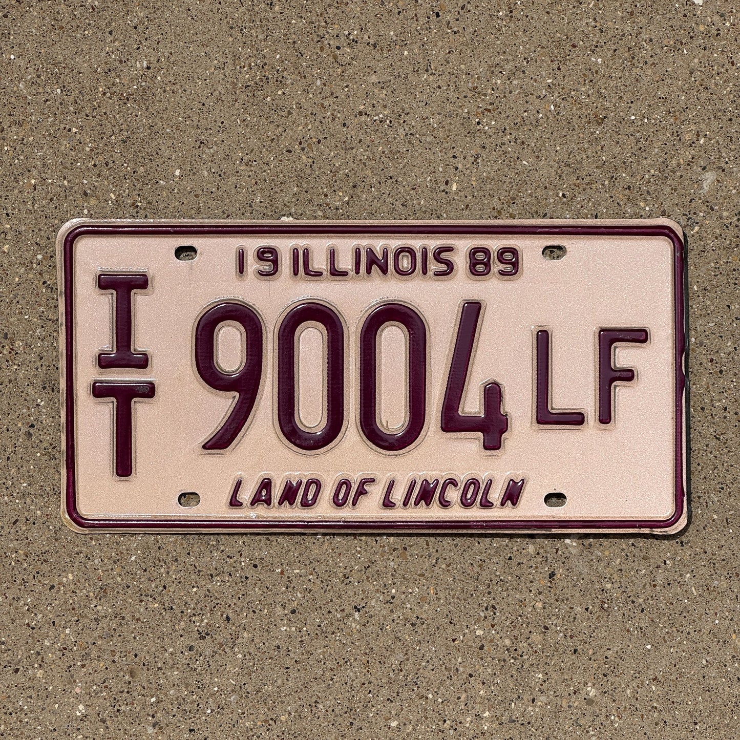 Photo of a 1989 Illinois In Transit License Plate Auto Tag Garage Decor Vintage IT 9004 LF