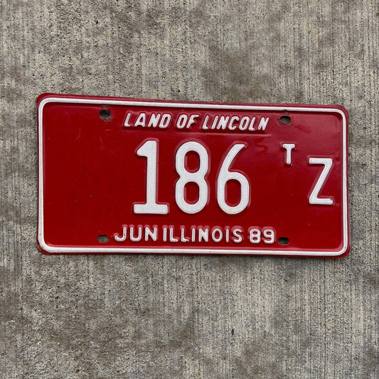 Photo of a 1989 Illinois Truck Tractor License Plate Auto Tag Garage Decor Vintage 186 TZ with original patina
