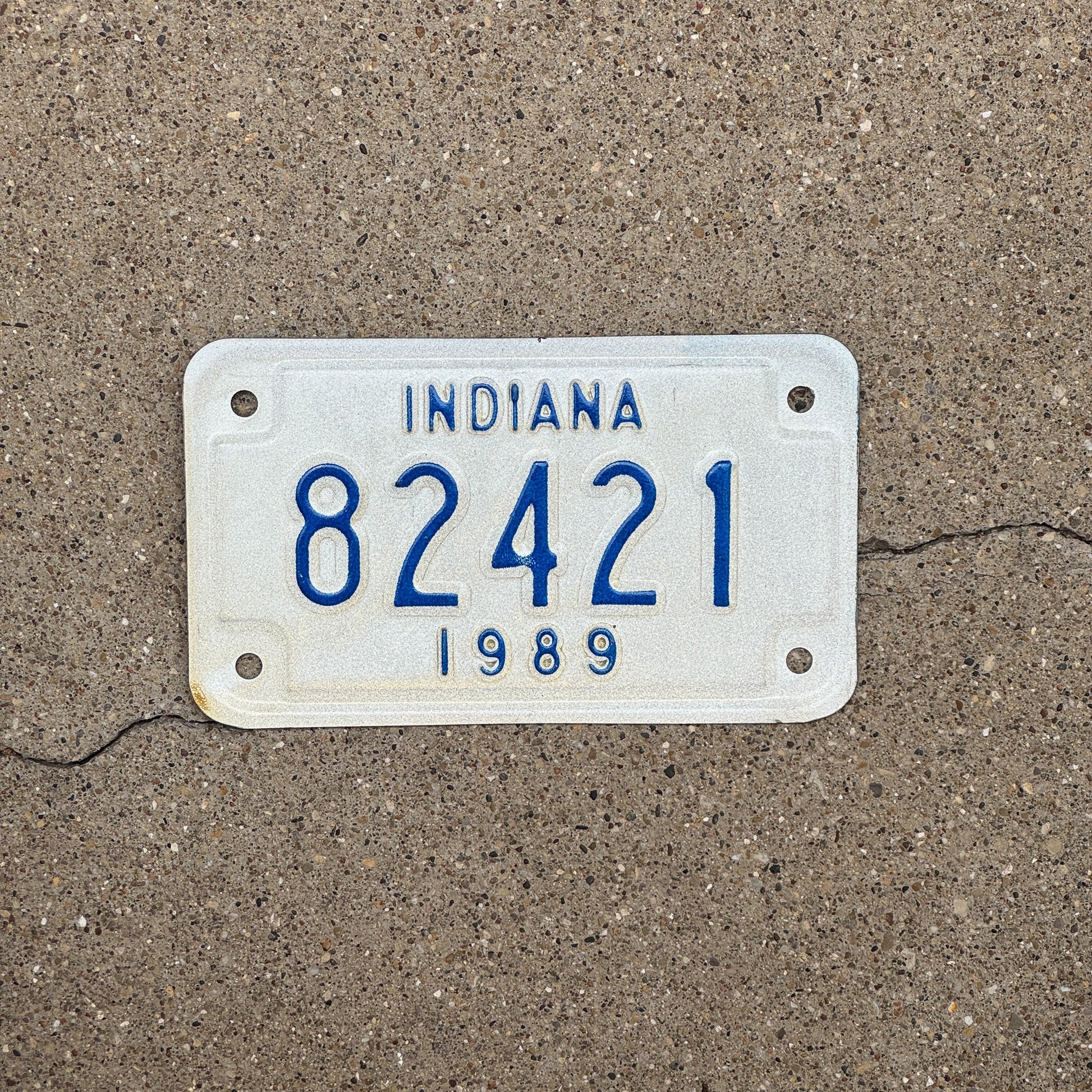Photo of a 1989 Indiana Motorcycle License Plate Auto Tag Garage Decor Vintage 82421