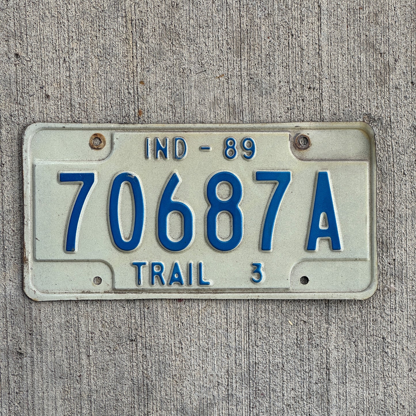 Photo of a 1989 Indiana Trailer License Plate Auto Tag Garage Decor Vintage 70687 A with original patina