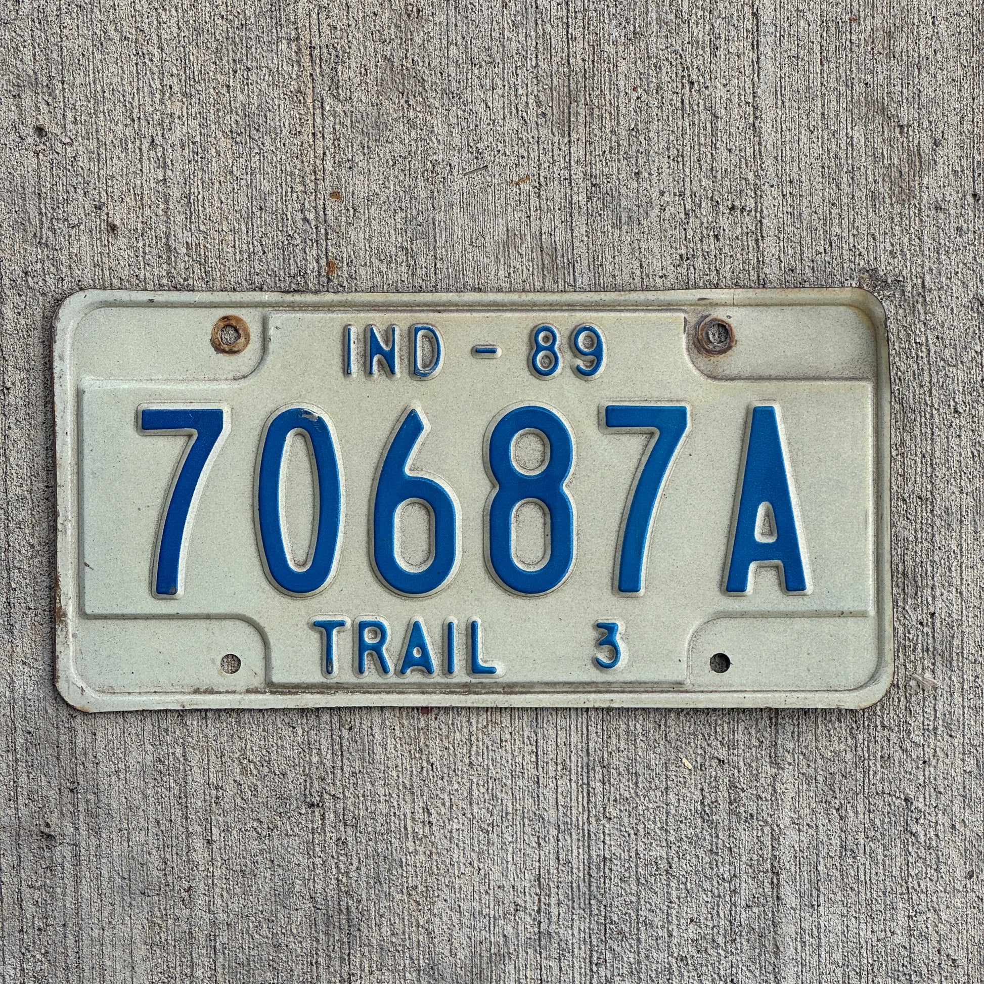 Photo of a 1989 Indiana Trailer License Plate Auto Tag Garage Decor Vintage 70687 A with original patina