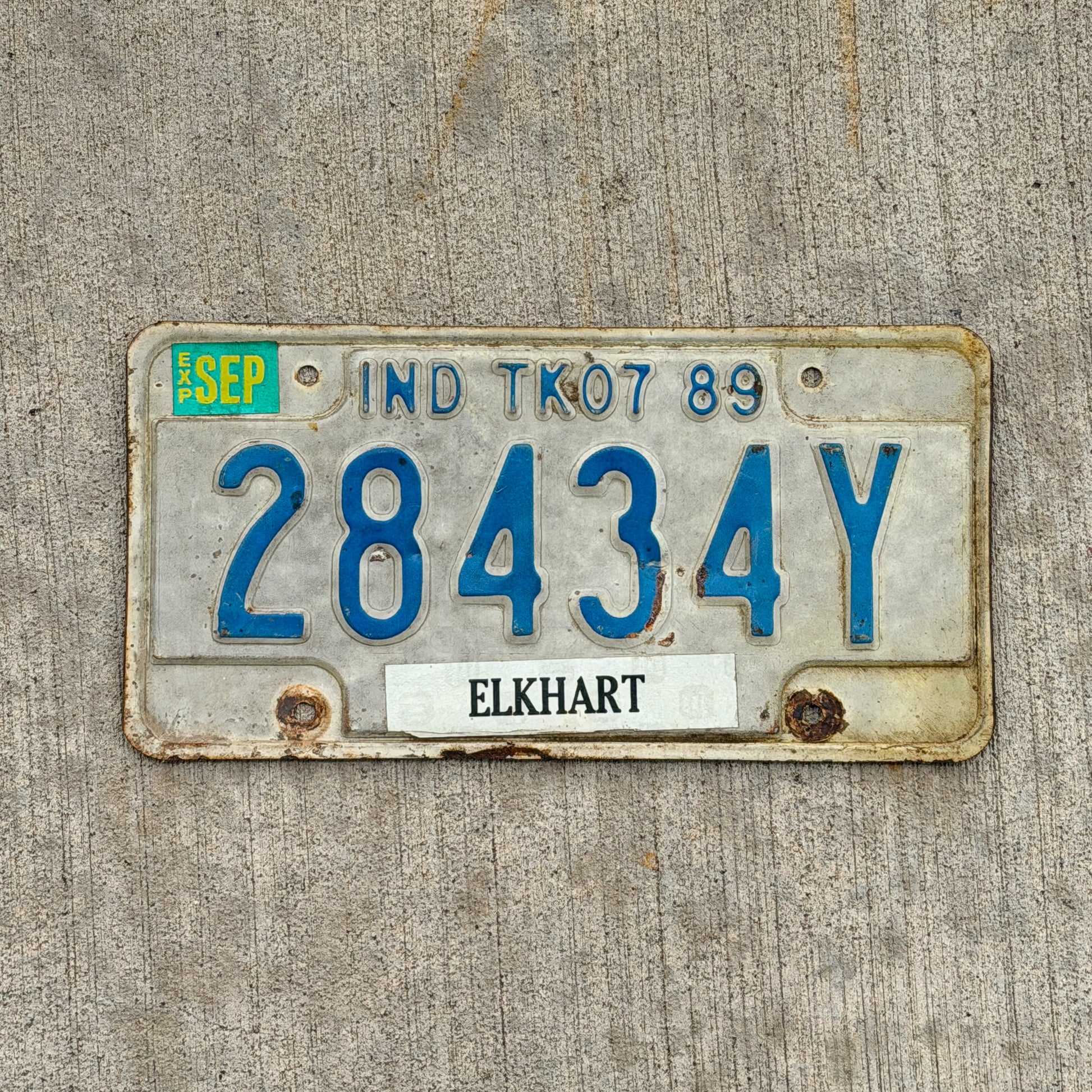Photo of a 1989 Indiana Truck License Plate Auto Tag Garage Decor Vintage 28434Y with original patina