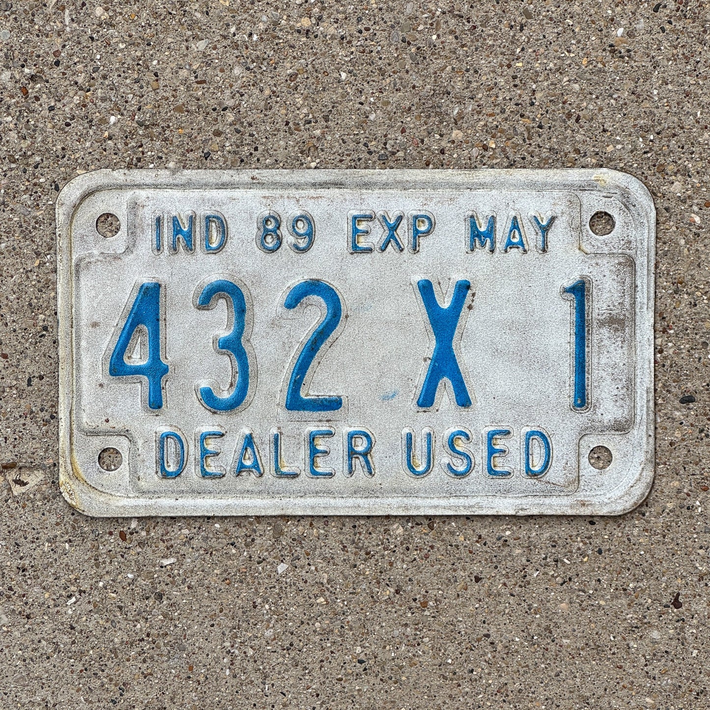 Photo of a 1989 Indiana Used Motorcycle Dealer License Plate Auto Tag Garage Decor Vintage 432 X 1 with original patina