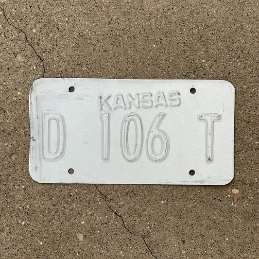 Photo of a 1989 Kansas Dealer Error License Plate Auto Tag Garage Decor Vintage Misprint D 106 T