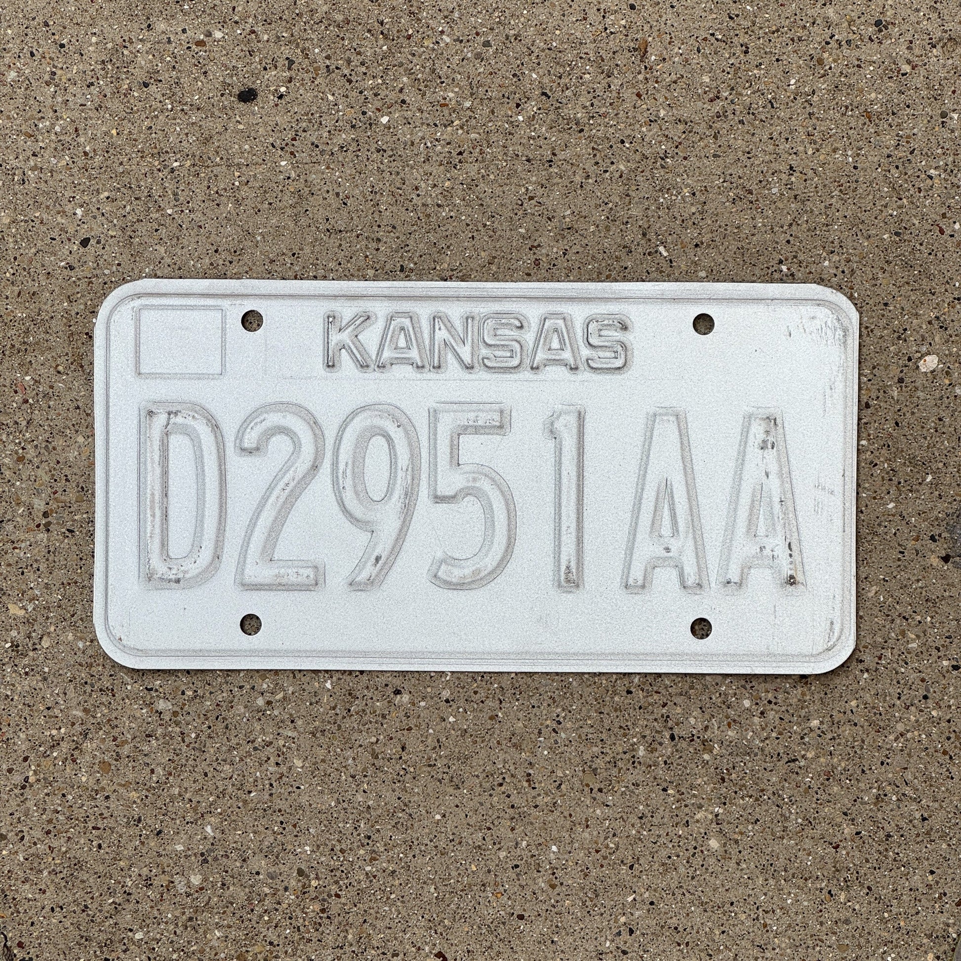 Photo of a 1989 Kansas Dealer Error License Plate Auto Tag Garage Decor Vintage Misprint D 2951 AA