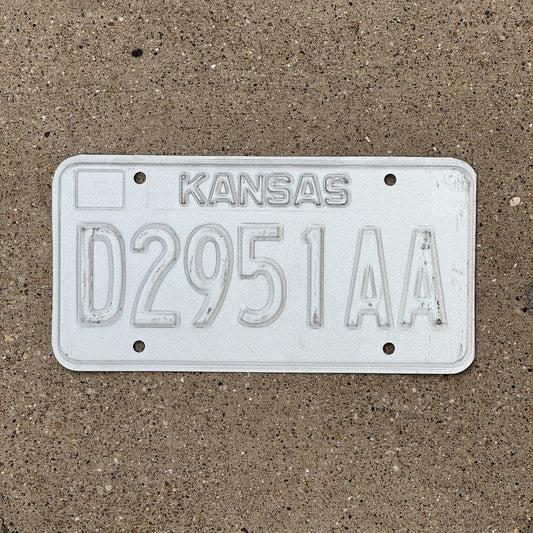 Photo of a 1989 Kansas Dealer Error License Plate Auto Tag Garage Decor Vintage Misprint D 2951 AA