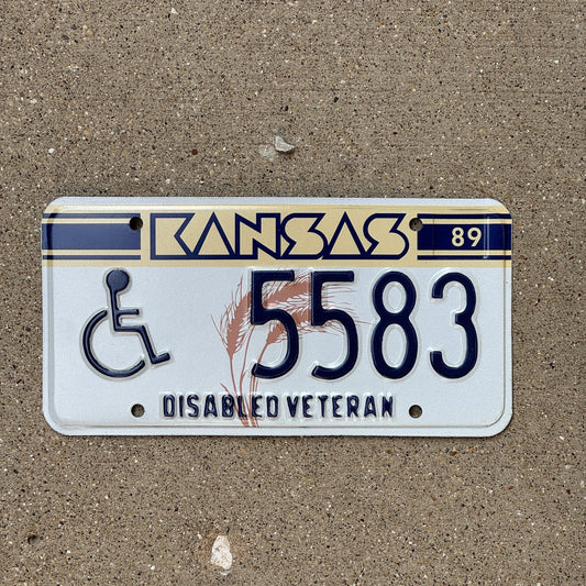 Photo of a 1989 Kansas Disabled Veteran License Plate Auto Tag Garage Decor Vintage Military 5583