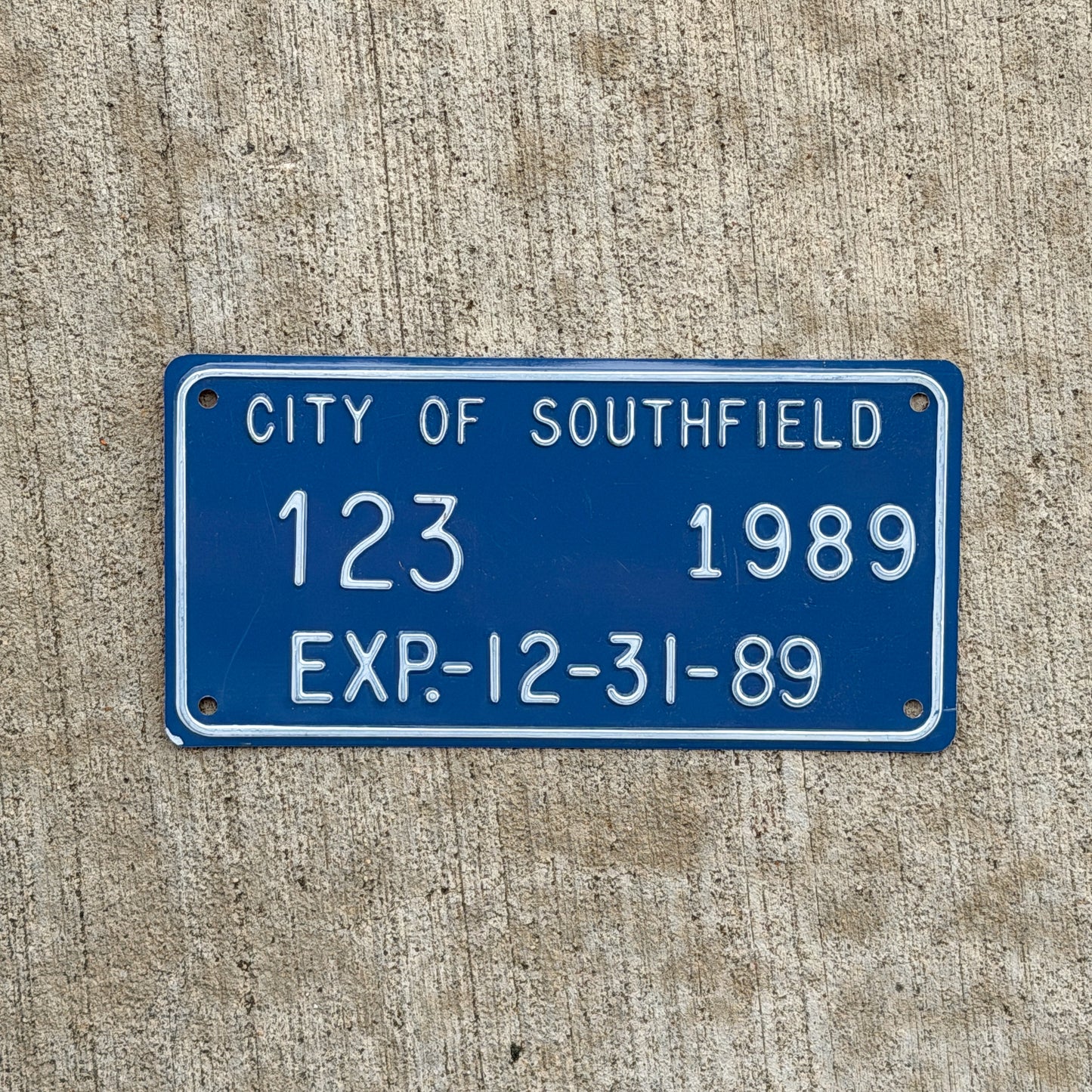 Photo of a 1989 Michigan License Plate Auto Tag Garage Decor Vintage City of Southfield 123 with original patina