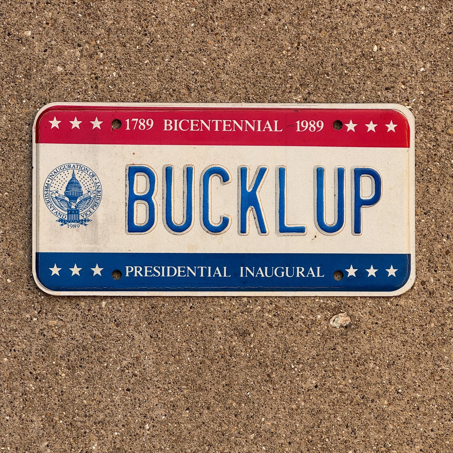 Photo of a 1989 Washington DC Vanity License Plate Auto Tag Garage Decor Vintage Buckle Up Bush Inauguration BUCKLUP