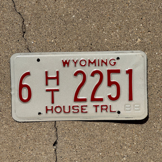 Photo of a 1989 Wyoming House Trailer License Plate Auto Tag Garage Decor Vintage 6 HT 2251