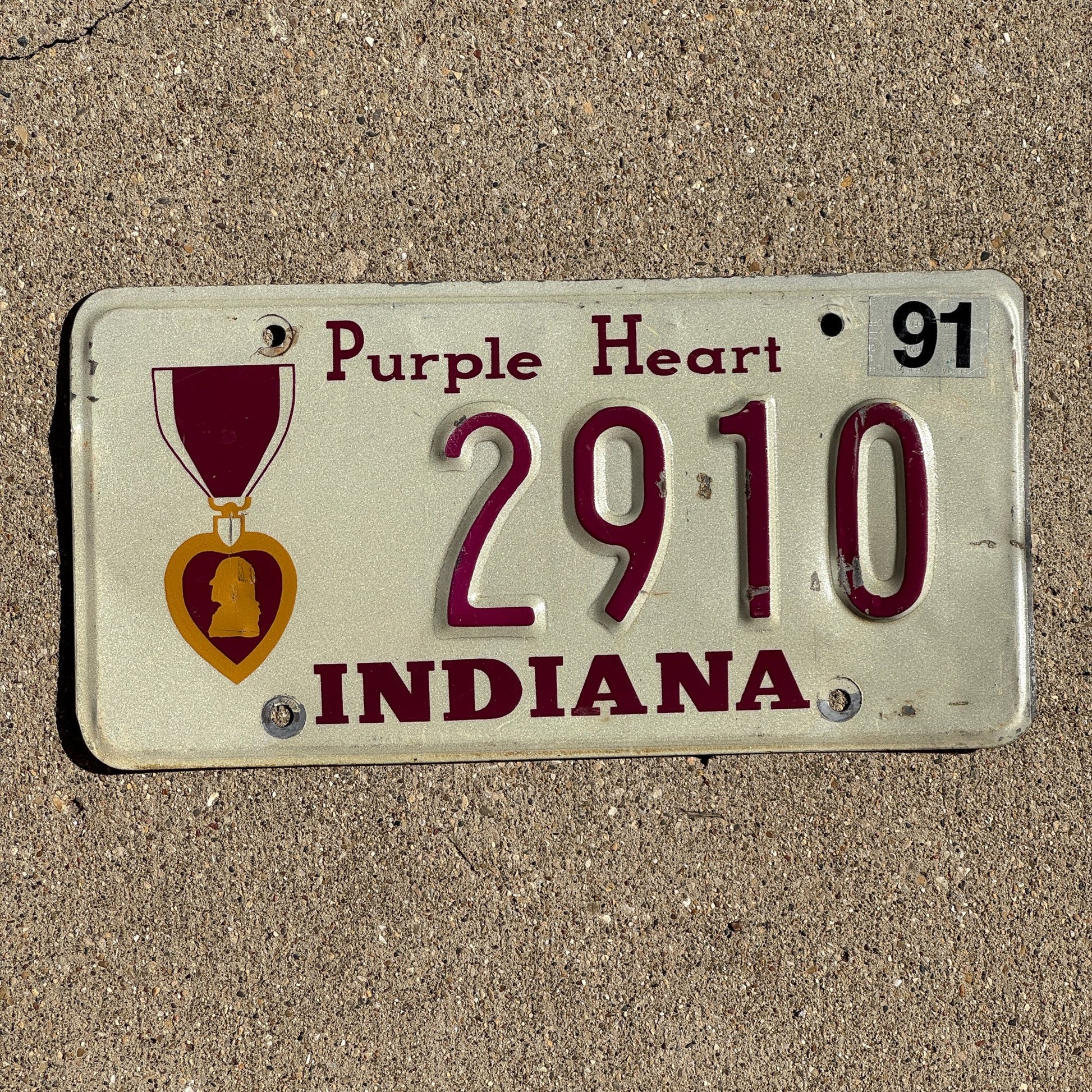 Photo of a 1990 1991 Indiana MILITARY License Plate Auto Tag Garage Decor Vintage Purple Heart 2910