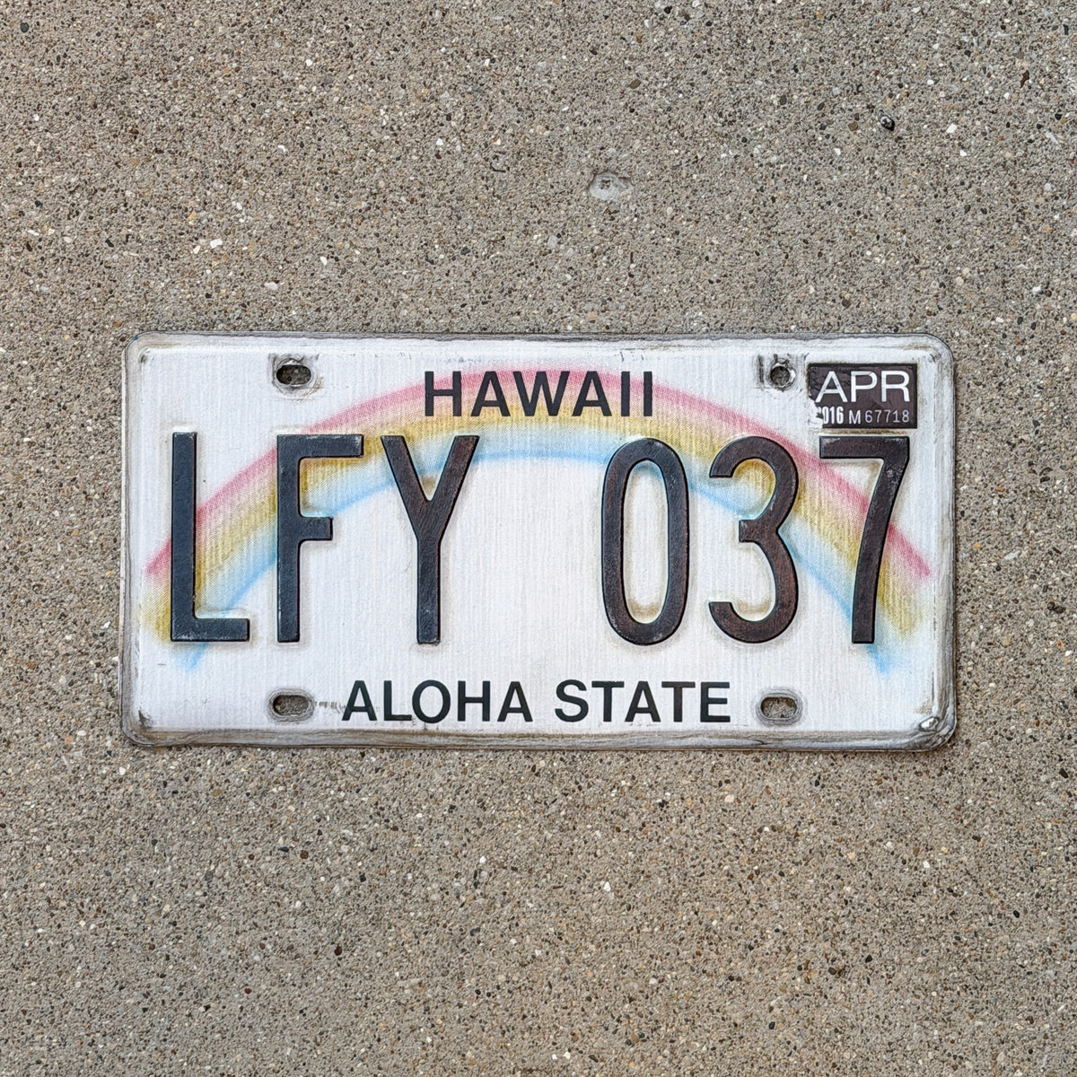 Photo of a 1990 2016 Hawaii License Plate Auto Tag Garage Decor Vintage Rainbow LFY 037 with original patina