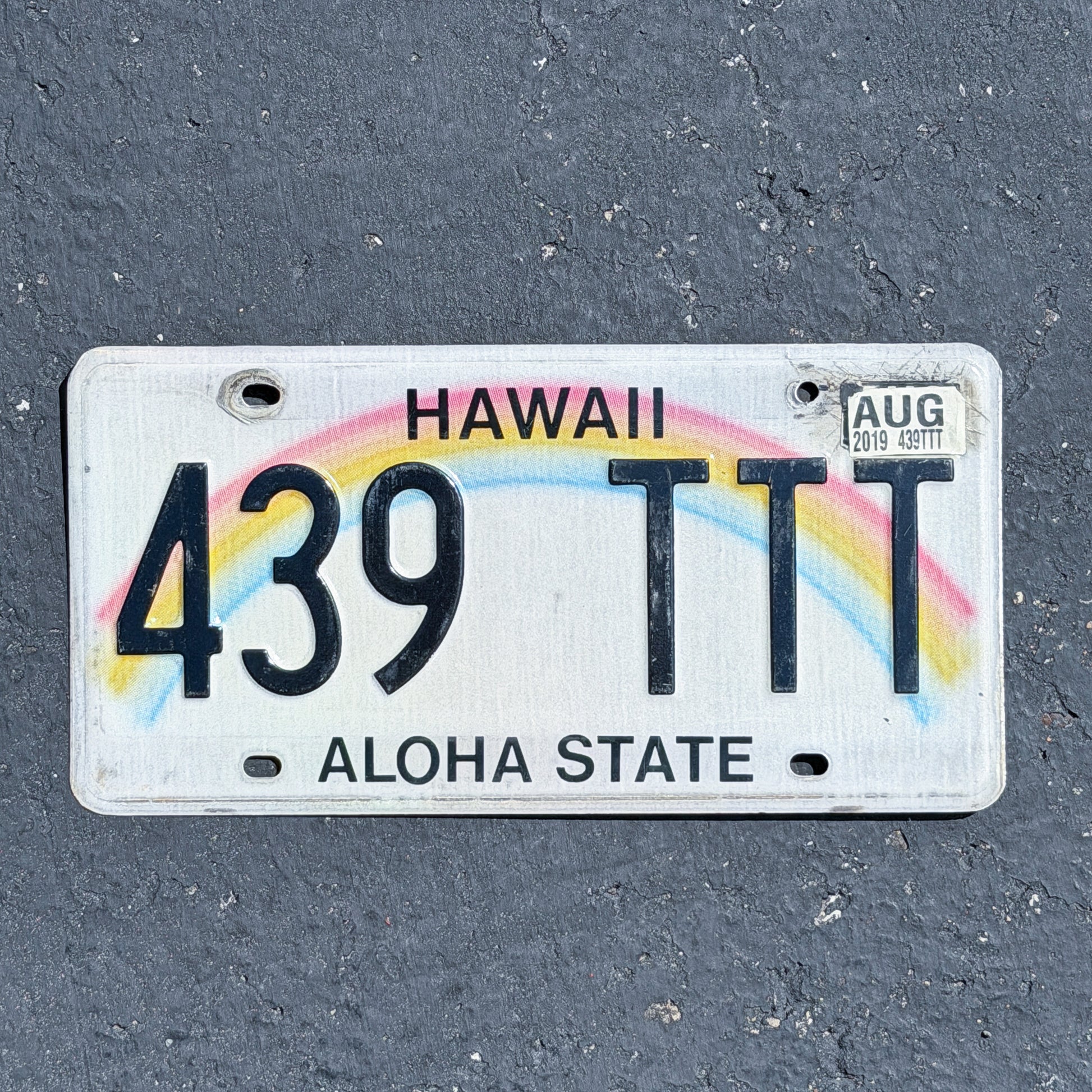 Photo of a 1990 2019 Hawaii License Plate Auto Tag Garage Decor Vintage Rainbow Repeat Repeating 439 TTT with original patina