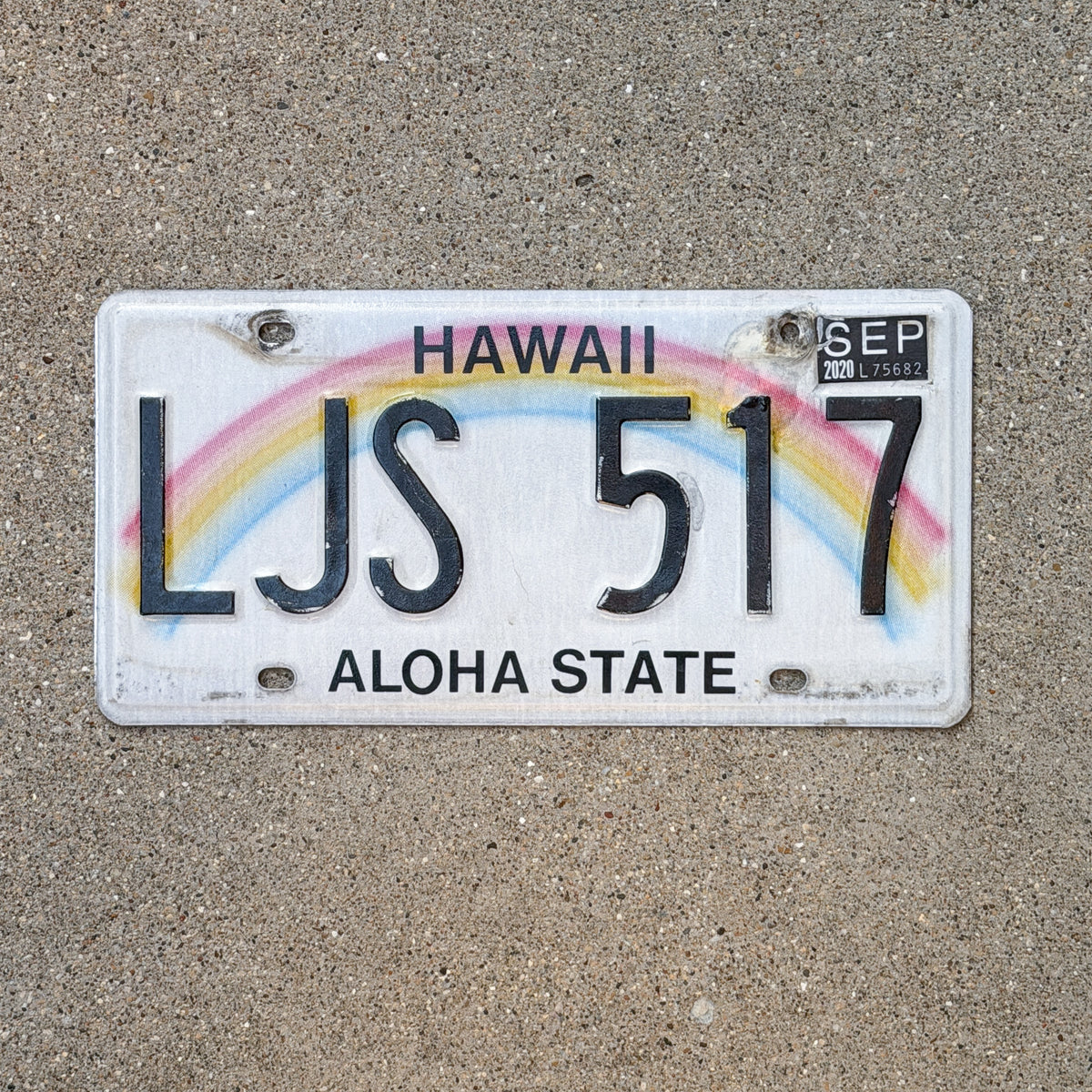 Photo of a 1990 2020 Hawaii License Plate Auto Tag Garage Decor Vintage Rainbow LJS 517 with original patina