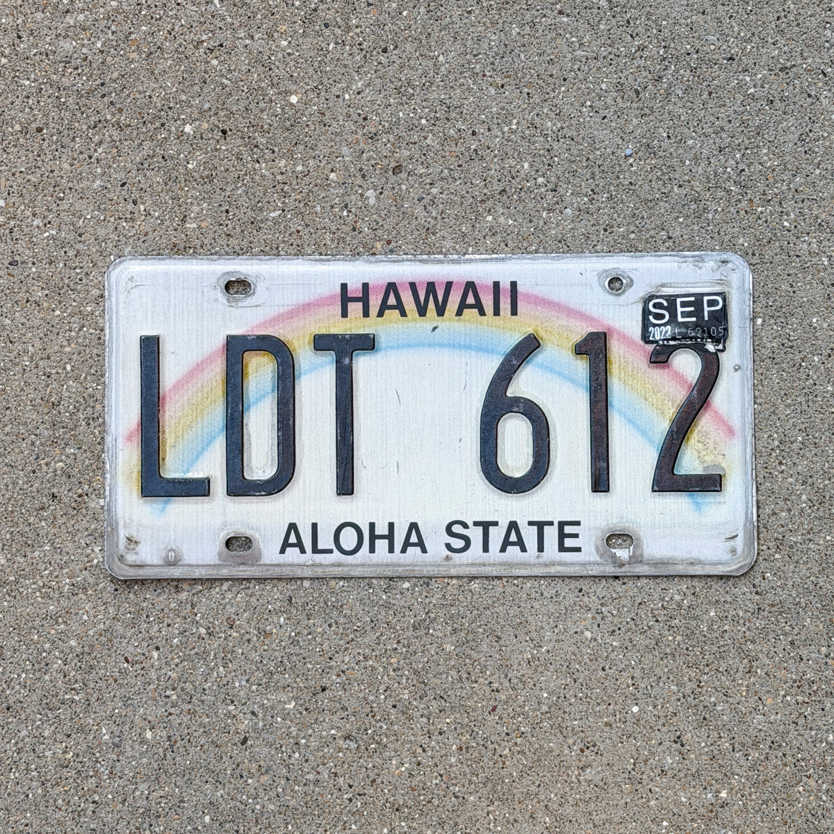 Photo of a 1990 2022 Hawaii License Plate Auto Tag Garage Decor Vintage Rainbow LDT 612 with original patina