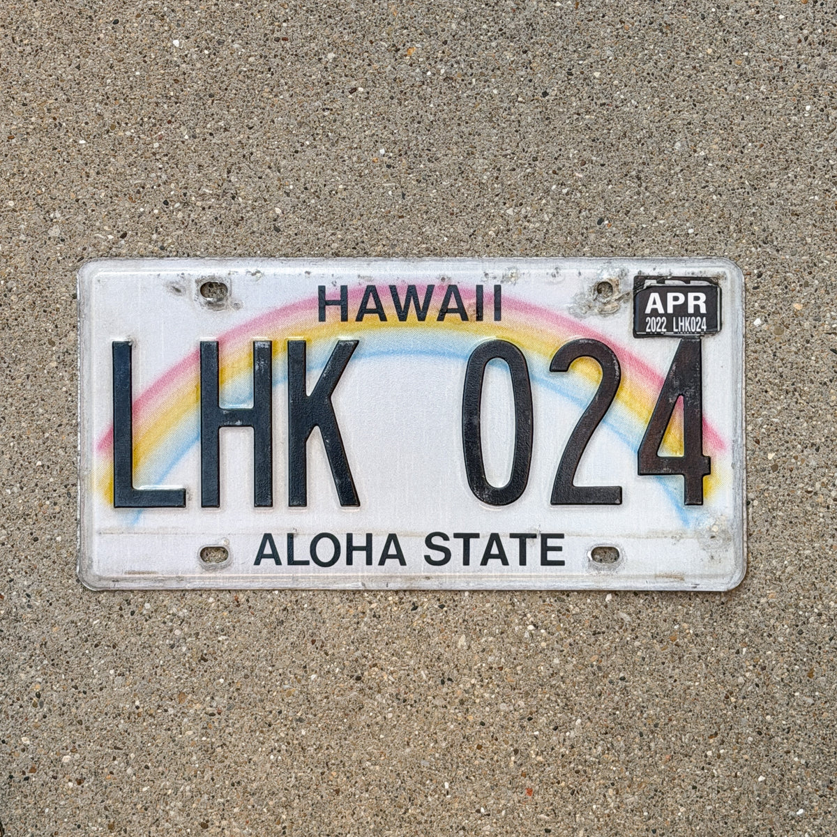 Photo of a 1990 2022 Hawaii License Plate Auto Tag Garage Decor Vintage Rainbow LHK 024 with original patina