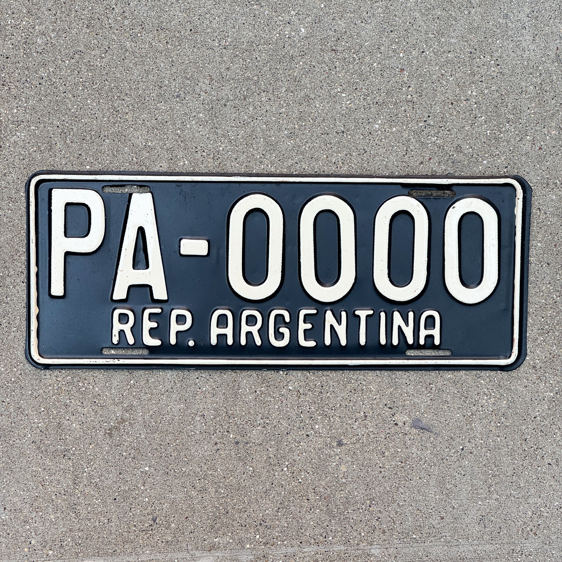 Photo of a 1990 Era Argentina Embassy Staff Sample License Plate Auto Tag Garage Decor Vintage PA 0000 with original patina