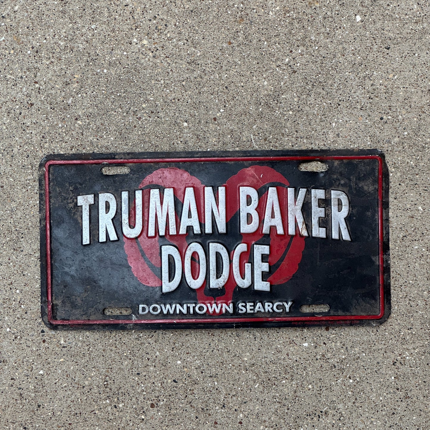 Photo of a 1990 Era Arkansas Booster License Plate Auto Tag Searcy AR Truman Baker Dodge