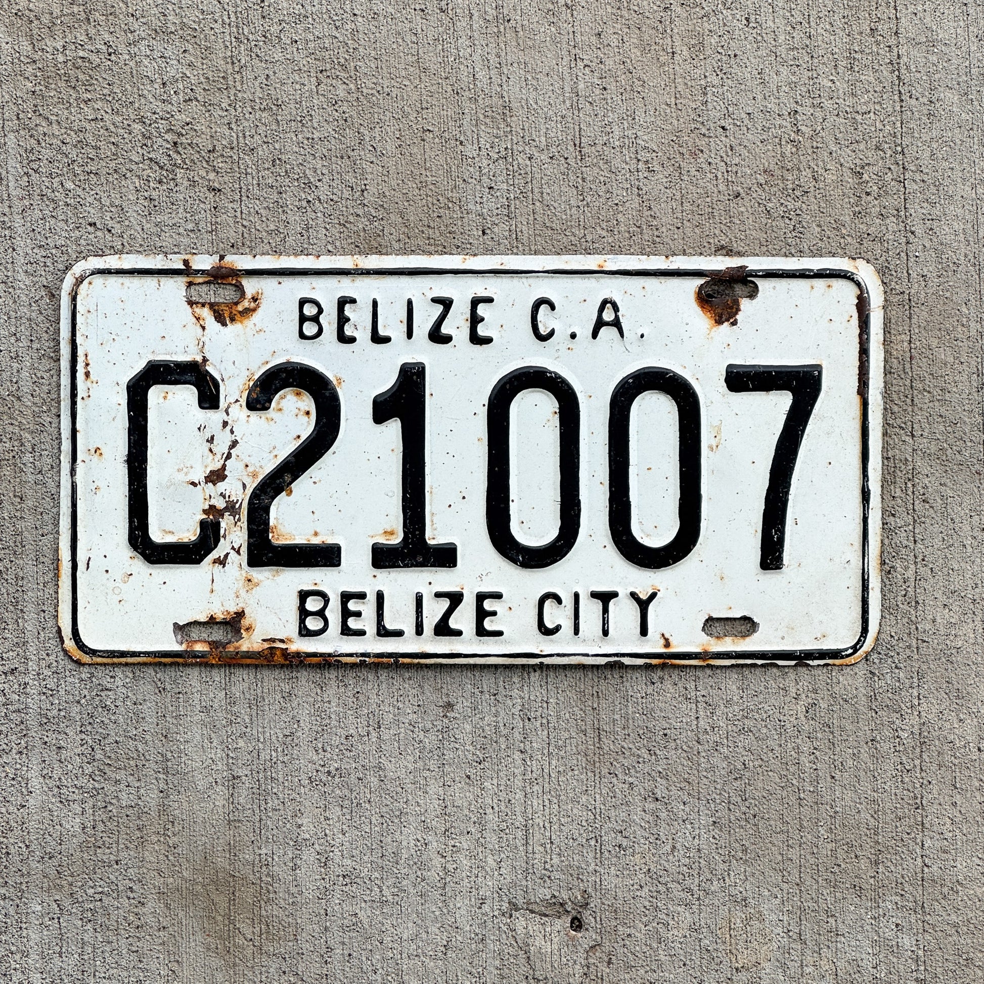 Photo of a 1990 Era Belize License Plate Auto Tag Garage Decor Vintage C 21007 with original patina