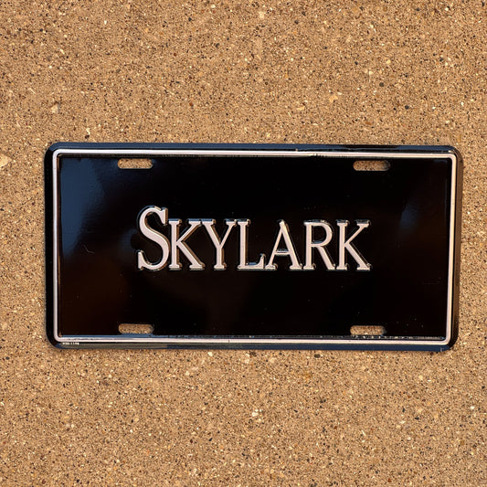 Photo of a 1990 Era Booster License Plate Auto Tag 2 Garage Decor Aluminum SKYLARK