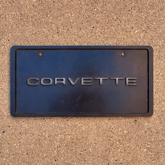 Photo of a 1990 Era Booster License Plate Auto Tag Garage Decor Vintage Plastic Corvette