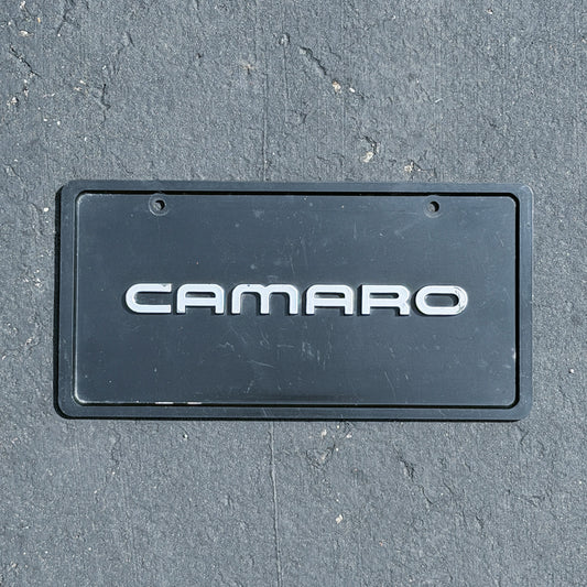 Photo of a 1990 Era Camaro Booster License Plate Auto Tag Garage Decor Vintage
 Chevrolet Chevy Plastic with original patina