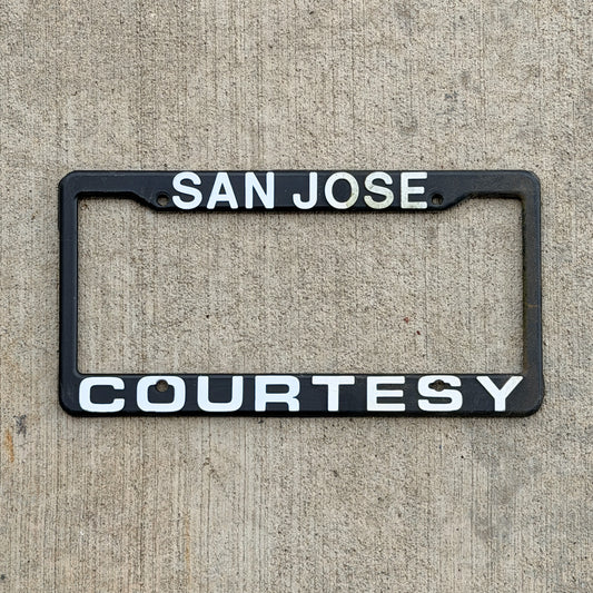 Photo of a 1990 Era Courtesy San Jose California Dealer License Plate Frame Auto Tag Garage Decor Vintage
 Plastic with original patina