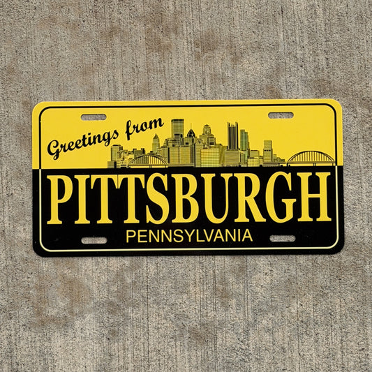 Photo of a 1990 Era Greetings From Pittsburgh Pennsylvania Booster License Plate Auto Tag Garage Decor Vintage
 Metal with original patina
