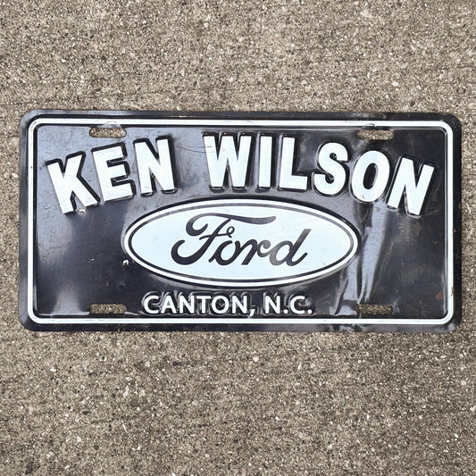 Photo of a 1990 Era Ken Wilson Ford North Carolina Dealer Booster License Plate Auto Tag Garage Decor Vintage
 Metal with original patina