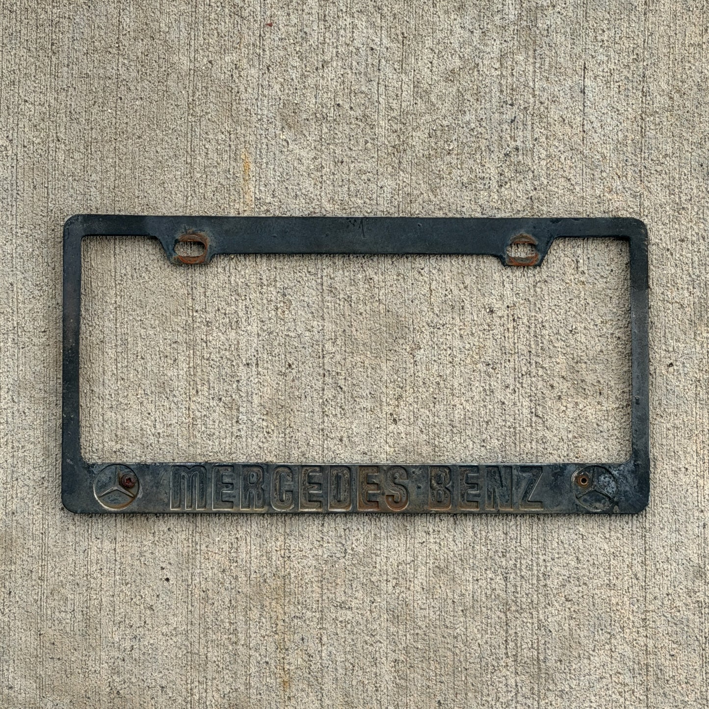 Photo of a 1990 Era License Plate Frame Auto Tag Garage Decor Vintage Mercedes Benz with original patina