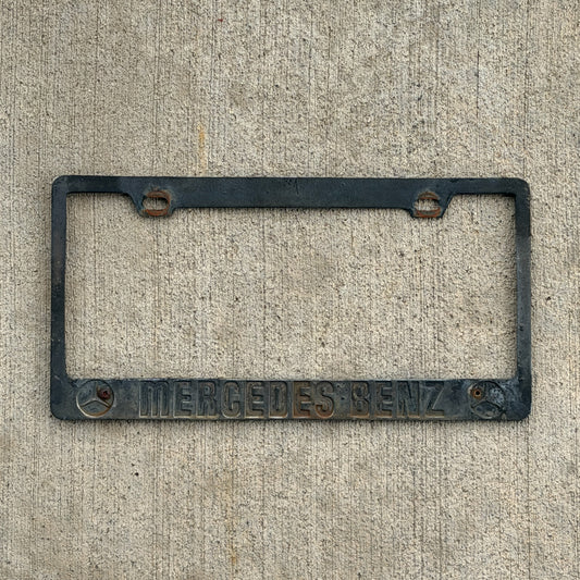 Photo of a 1990 Era License Plate Frame Auto Tag Garage Decor Vintage Mercedes Benz with original patina