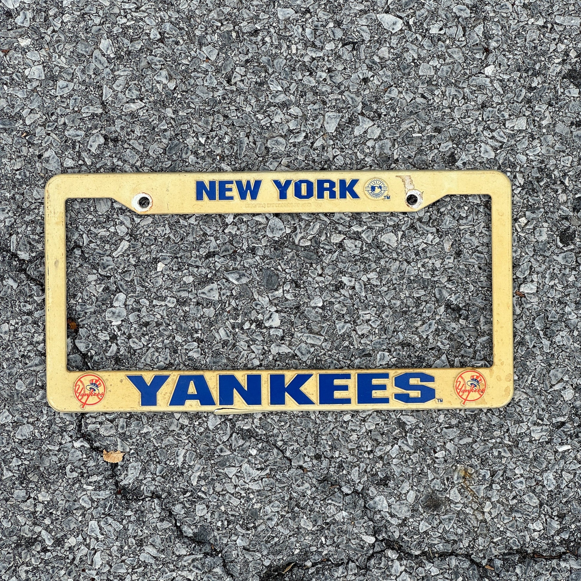 Photo of a 1990 Era New York License Plate Frame Auto Tag Garage Decor Vintage Plastic Yankees MLB