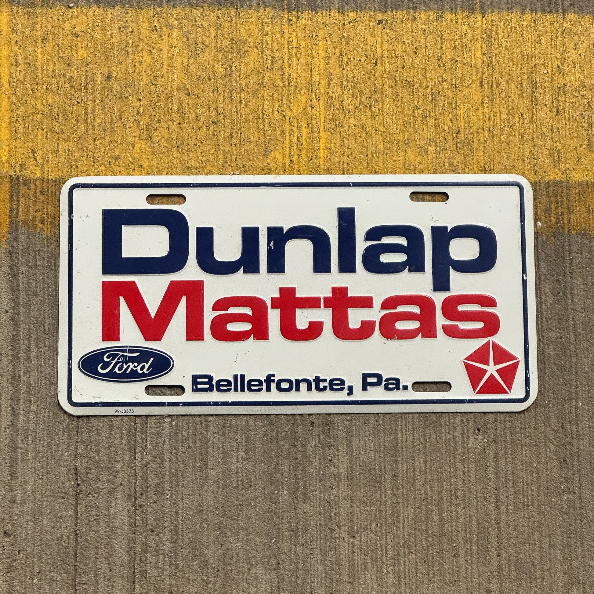 Photo of a 1990 Era Pennsylvania Booster License Plate Auto Tag Garage Decor Vintage Bellefonte Dunlap Mattas with original patina