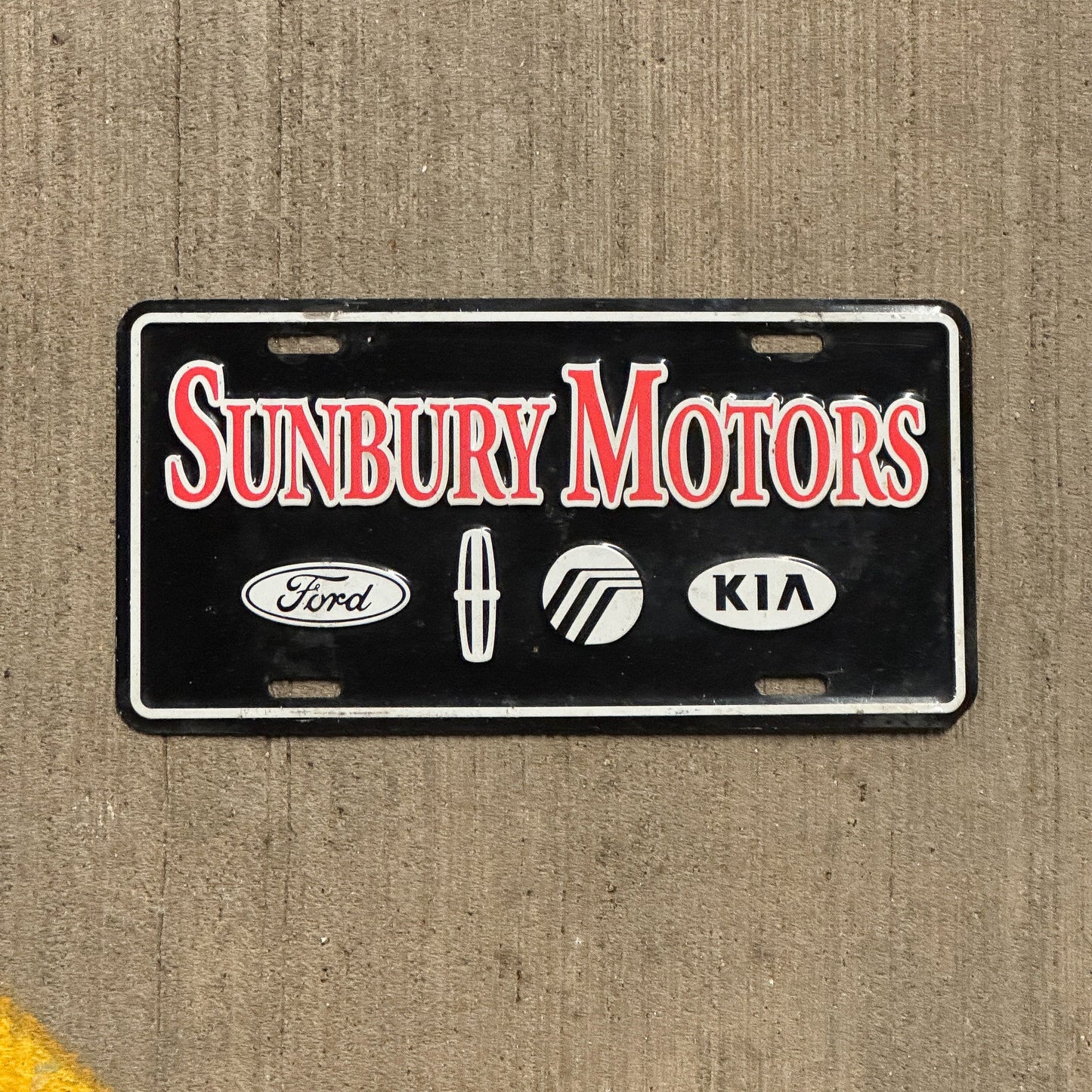 Photo of a 1990 Era Pennsylvania Booster License Plate Auto Tag Garage Decor Vintage Ford Kia Sunbury Motors with original patina