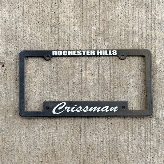 Photo of a 1990 Era Rochester Hills Michigan Dealer License Plate Frame Auto Tag Garage Decor Vintage
 Plastic Crissman Lincoln Mercury with original patina