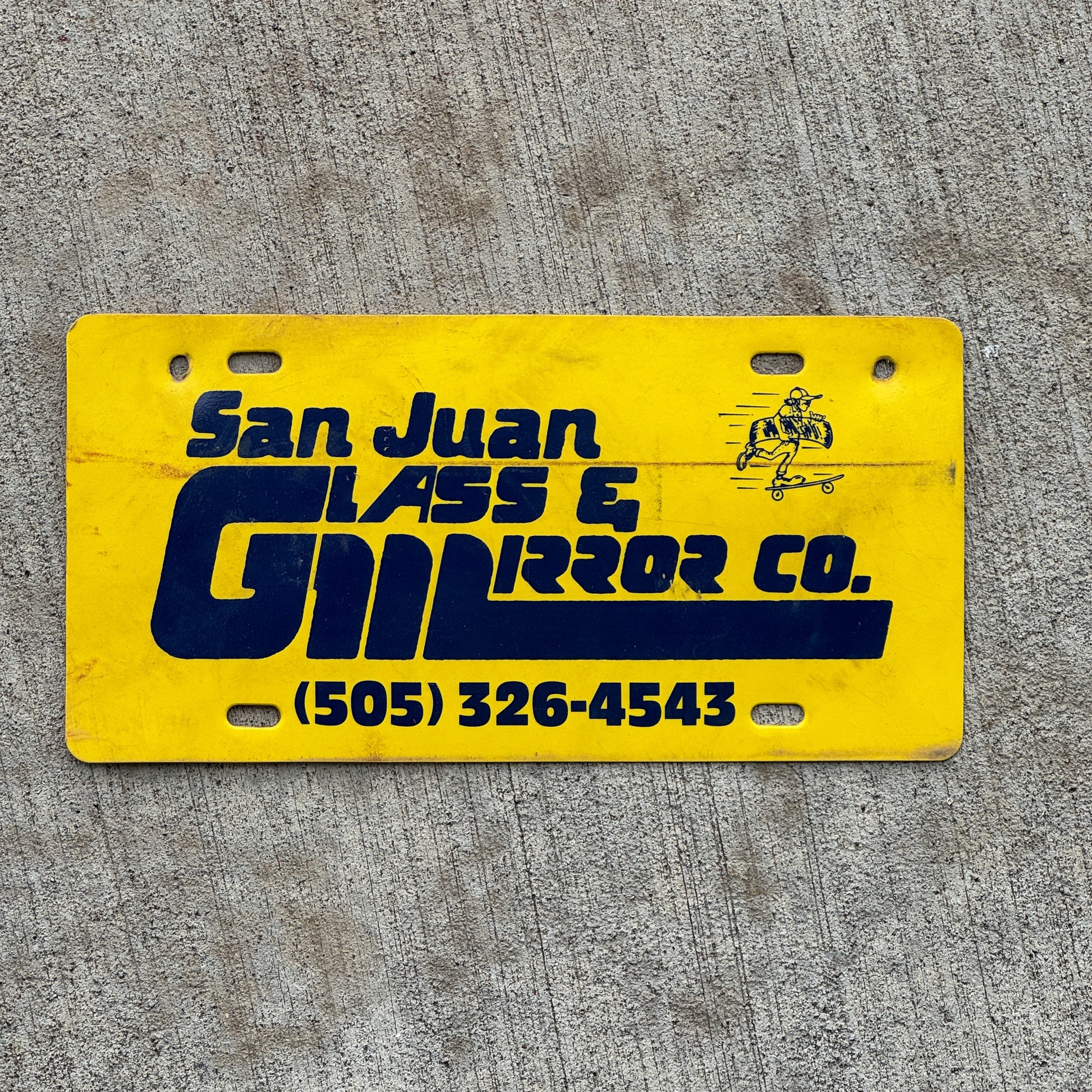 Photo of a 1990 Era San Juan Glass Mirror Co New Mexico Booster License Plate Auto Tag Garage Decor Vintage Flimsy Plastic with original patina