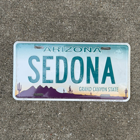 Photo of a 1990 Era Sedona Arizona Booster License Plate Auto Tag Garage Decor Vintage
 Souvenir with original patina