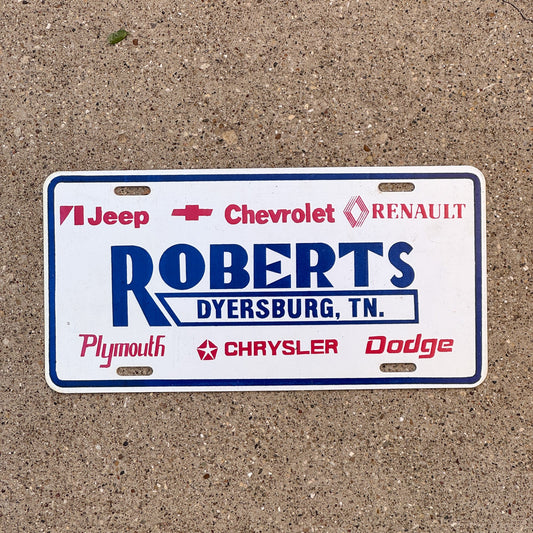 Photo of a 1990 Era Tennessee Dealer Booster License Plate Auto Tag 1 Garage Decor Dyersburg TN Plastic ROBERTS with original patina