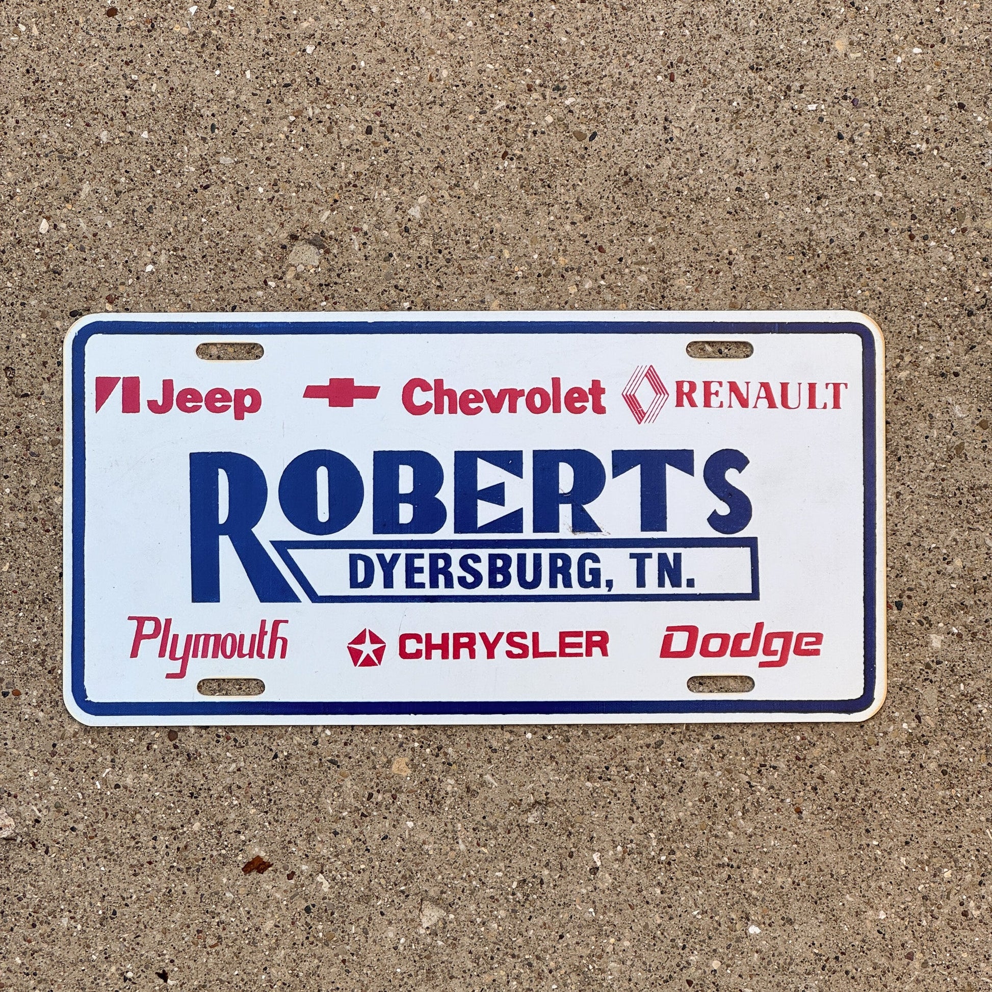 Photo of a 1990 Era Tennessee Dealer Booster License Plate Auto Tag 2 Garage Decor Dyersburg TN Plastic ROBERTS with original patina