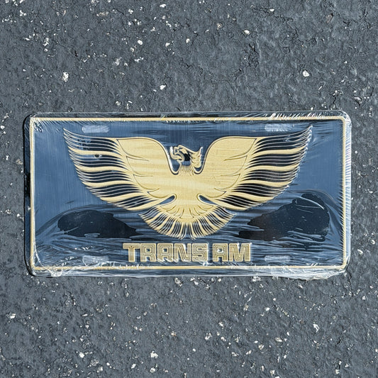 Photo of a 1990 Era Trans AM Booster License Plate Auto Tag 4 Vintage
 Firebird Classic Car NOS Metal with original patina