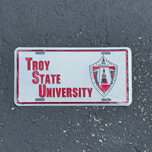 Photo of a 1990 Era Troy State University Alabama Booster License Plate Auto Tag Garage Decor Vintage
 College Sports NOS Metal with original patina