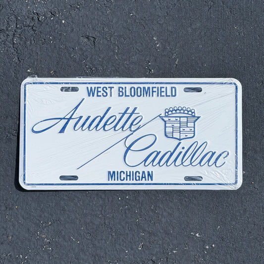 Photo of a 1990 Era West Bloomfield Michigan Booster License Plate Auto Tag Garage Decor Vintage
 Audette Cadillac Metal with original patina