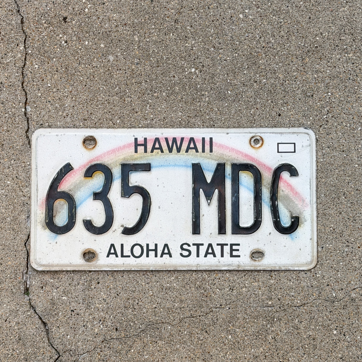 Photo of a 1990 Hawaii License Plate Auto Tag Garage Decor Vintage Rainbow 635 MDC with original patina