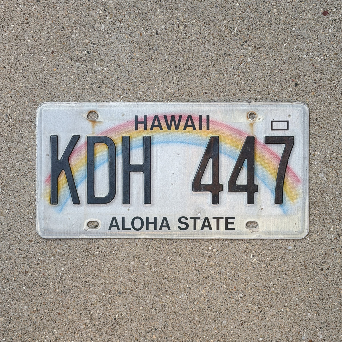 Photo of a 1990 Hawaii License Plate Auto Tag Garage Decor Vintage Rainbow KDH 447 with original patina