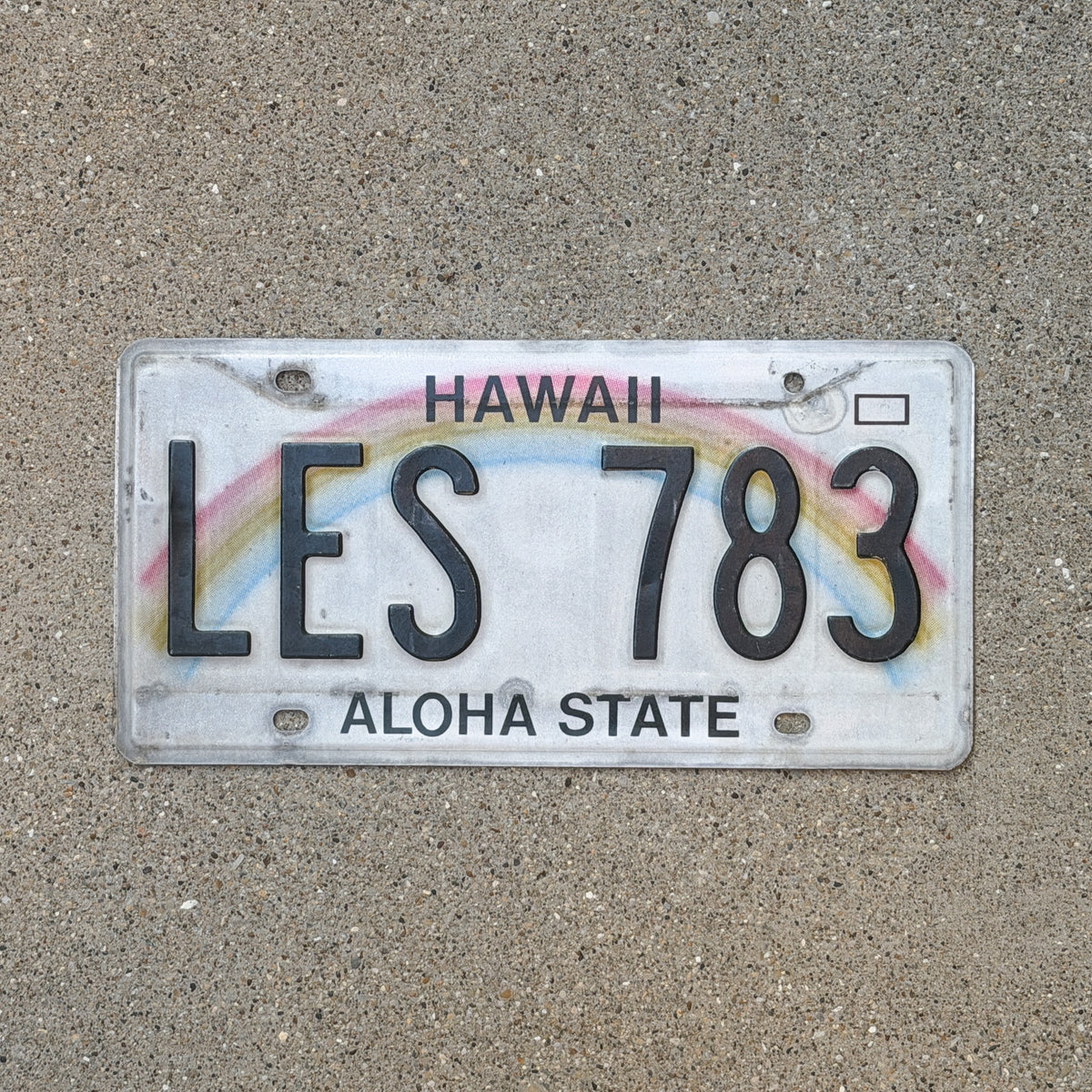 Photo of a 1990 Hawaii License Plate Auto Tag Garage Decor Vintage Rainbow LES 783 with original patina