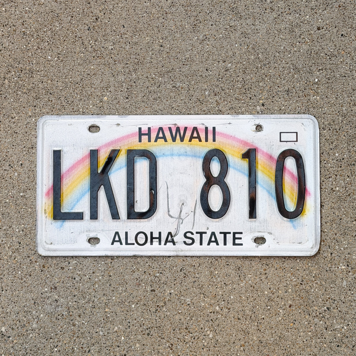 Photo of a 1990 Hawaii License Plate Auto Tag Garage Decor Vintage Rainbow LKD 810 with original patina