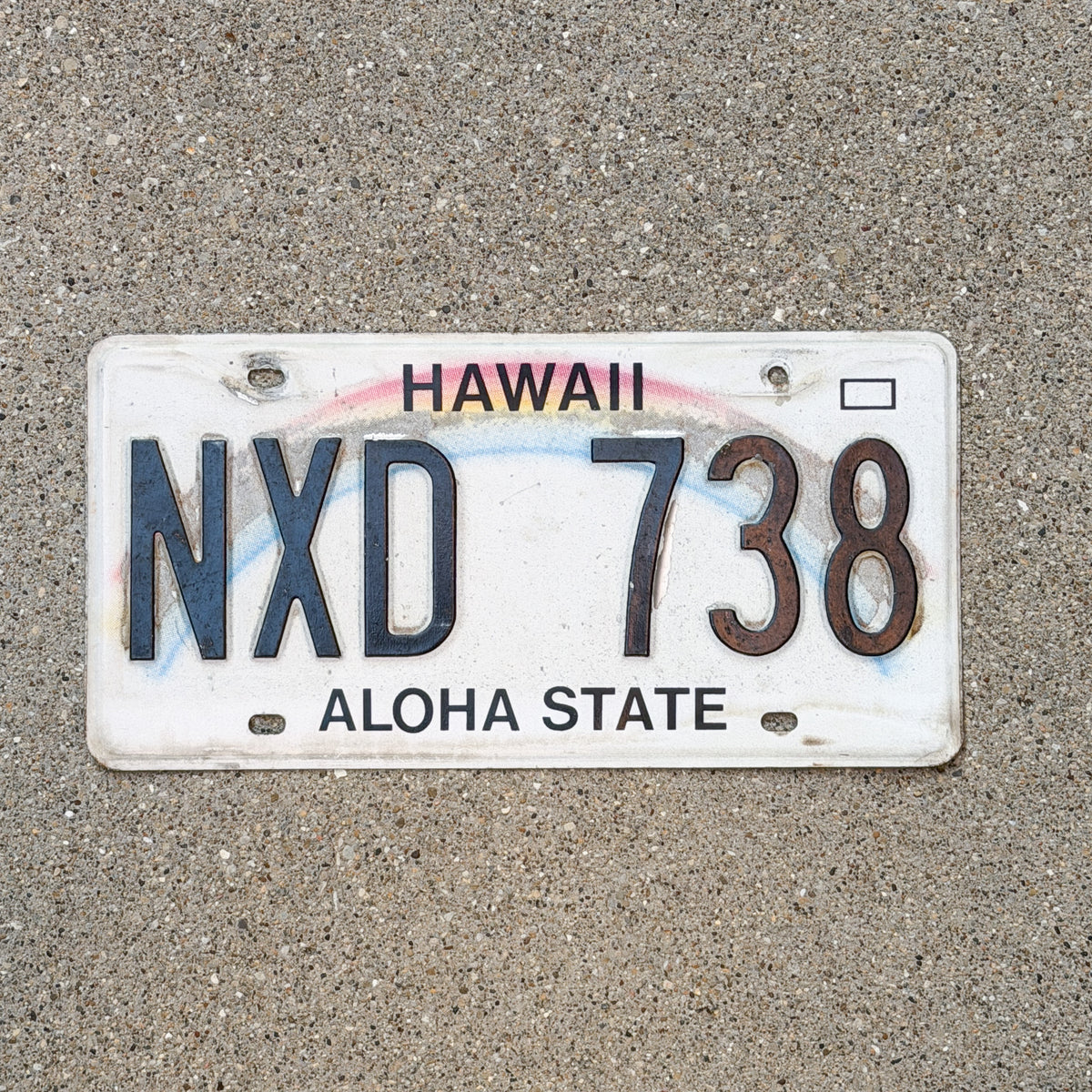 Photo of a 1990 Hawaii License Plate Auto Tag Garage Decor Vintage Rainbow NXD 738 with original patina