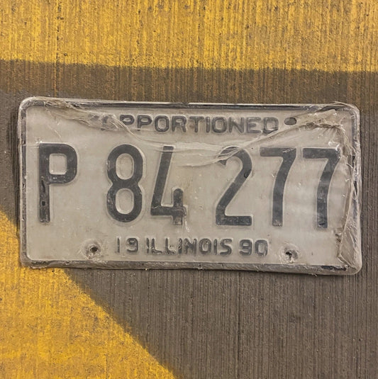 Photo of a 1990 Illinois Apportioned License Plate Auto Tag Garage New Old Stock P 84277