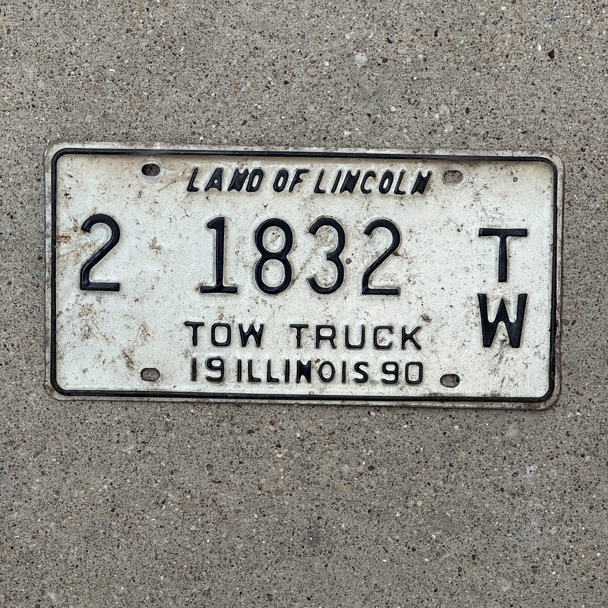 Photo of a 1990 Illinois Tow Truck License Plate Auto Tag 1 Vintage Garage 2 1832 TW with original patina